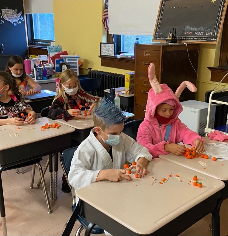making candy pumpkin towers